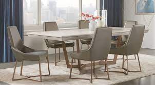 Styling details include mixed media counter set with shaped wooden seat for style and comfort, sled base chairs with canted legs, weighty table top design. Furniture Sofia Vergara