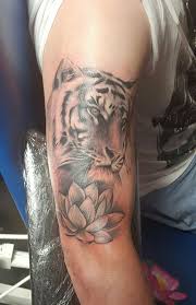 Black And Grey Flower Half Sleeve Tattoos Black And Grey Tiger Head With Lotus Flower Tattoo On Half Sleeve Half Sleeve Tattoo Half Sleeve Tattoos Designs Cool Half Sleeve Tattoos