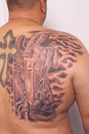 Dark grey archangel tattoo on left half sleeve. Wonderful Black Ink Archangel Michael Tattoo On Man Right Back Shoulder
