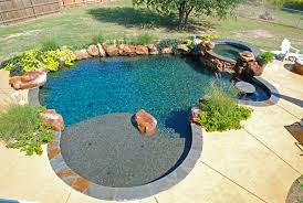 Freeform pool with landscaping texas pools & patios with locations in austin, marble falls, dripping springs, & san antonio | phone: Contrast Allison Landscpe Pool Company