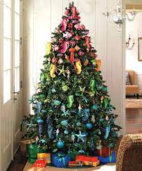 Hang seashells on pieces of driftwood. Beach Christmas Decorations Ideas Inspired By Sea Sand Shells Beach Bliss Living Rainbow Christmas Tree Beach Style Christmas Decorations Beautiful Christmas Trees