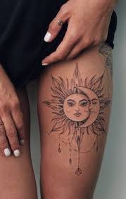 50 Meaningful And Beautiful Sun And Moon Tattoos In 2020 Thigh Tattoo Moon Tattoo Thigh Tattoos Women