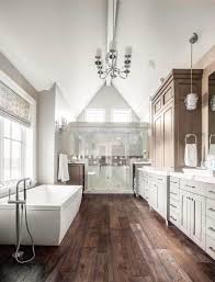 Blending modern and rustic qualities, the wooden tiles and subway designs are such a fun pairing. 90 Primary Bathrooms With Hardwood Flooring Photos