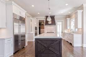 Check spelling or type a new query. A Pair Of Mini Industrial Pendants Hang Over A Dark Brown Kitchen Island Fitted With Stacked Drawers As Well As X P White Quartz Countertop Home Brown Kitchens