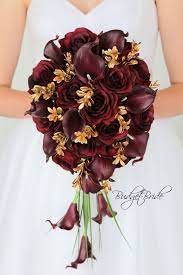 Maybe you would like to learn more about one of these? Wine And Gold Cascading Davids Bridal Wedding Flowers Burgundy Real Touch Calla Lilies Wedding Flowers Bridal Bouquets Gold Wedding Flowers Red Wedding Flowers