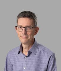 A Cost and Power Feasibility Analysis of Quantum Annealing for NextG  Cellular Wireless Networks