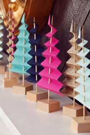 Learn How To Make A Folded Paper Tree Forest For Your Holiday Mantel Curbly Rezepte Abendessen Paper Tree Holiday Mantel Wine Bottle Diy Crafts