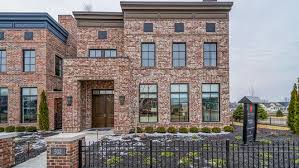 The term is also used in the united states to refer to a townhouse clad in this or any other aesthetically similar material. Hot Property This Brownstone Style Home In Carmel Has A Rooftop Patio