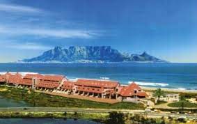 View Of The Dolphin Beach Hotel With Table Mountain In The Background Http Www South African Hotels C Cape Town Hotels Beach Hotels Table Mountain Cape Town