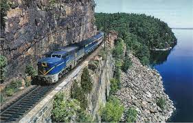 if we see trains hugging cliffs amid spectacular scenery it s usually some place out west here the d h hugs a ledge over lake cha lake champlain train scenery
