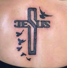 Doves are very gentle in nature and this bird with a meek temperament is considered symbol of peace. Black Cross With Birds Jesus Message Tattoo On Back