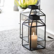With an antique bronze finish and delicate mesh, these candleholders offer endless uses beyond housing candles. Glass Lantern Candle Holder The Little House Shop