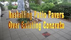 This paver installation is over existing concrete that has been painted. Installing Patio Pavers Over Existing Concrete Youtube