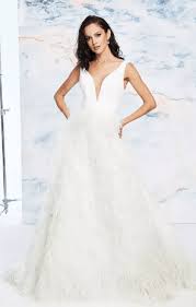 Strapless sweetheart neckline lace and heavily embellished mermaid wedding dress with a feather skirt. 26 Feather Accented Wedding Gowns For Dreamy Brides The Inspired Bride