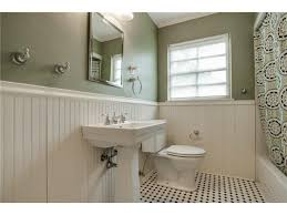 This cozy bathroom by jessica helgerson but what makes this space special is the combination of a beadboard wall and a mosaic tile floor. Hall Bath Updated With Period Style Bead Board Wainscoting And D Candysdirt Com