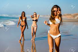 Three Beautiful Girls Having Fun On The Beach Stock Photo, Picture and  Royalty Free Image. Image 84229597.