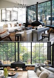 Maybe you would like to learn more about one of these? A Grid Of Square Black Window Frames Cover The Back Wall Of This Renovated House
