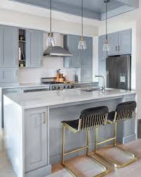 light blue kitchen cabinets with brass