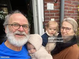 1,119 Grandmother Carrying Baby Stock Photos, High-Res Pictures, and Images 