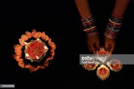 Woman Arranging Decorated Diya Earthen Lamps With Flower On The Eve Diwali Lights Diwali Photography Decor