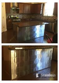 Many restaurants have been using stainless steel sheets in their kitchens for years, in order to give a shiny and clean appearance. Stainless Steel Tiles Cover Kitchen Island Custom Corner Tiles For A Clean Fi Stainless Steel Tile Backsplash Stainless Steel Tile Stainless Steel Backsplash