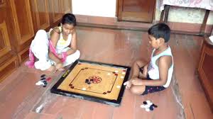 How To Play Carrom Board Recreation Two Kids Playing Carrom Board Two Little Ones Playing Carrom Board In Funny Way Carrom Board Game Carrom Board Board Games