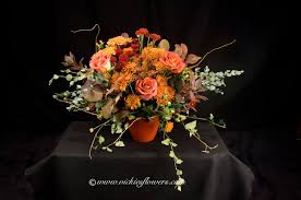 Orange mini calla lilies, orange spray roses, orange orchids. Wedding Flowers Vickies Flowers Brighton Colorado Florist