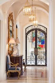 Featured are four macedonia limestone custom cased openings, a macedonia limestone arched cased opening, macedonia limestone wrapped beams at the ceiling with custom designed crown molding, and macedonia limestone baseboard molding. Arched Double Doors Houzz