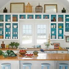 I painted the inside of our open shelving white to help it stand out against our olive green cabinets. Teal Cabinet Paint Color Inspiration Home Styling Bookshelves Home Decor