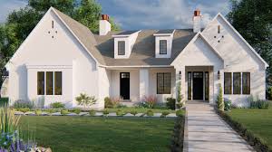 A welcoming front porch brings you into a stunning living, dining, and open kitchen area in this stylish cottage house plan. Quick House Plans