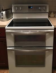 It has more of a modern look, like frosted glass. White Ice 6 7 Cu Ft Electric Double Oven Range With True Convection Wge745c0fh Whirlpool