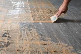 Once the stain clears, use another damp cloth to wipe away the bleach. How To Refinish Hardwood Floors Diy Home Improvement Hgtv