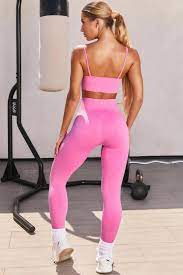 She wore a matching sports bra that featured a hood and a conservative neckline. Empower Seamless V Neck Sports Bra In Pink Bo Tee