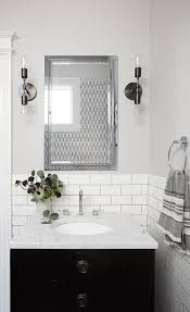 Soft Gray Walls Are Accented With White Subway Tiles Finished With Gray Grout Lined W Tile Backsplash Bathroom Black Vanity Bathroom White Subway Tile Bathroom