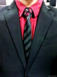 Business Attire Red Inner Shirt Four Patterned Necktie With The Black On Surface In Eldredge Tie Knot Black Suit Inner Shirts Tie Knots Black Suits