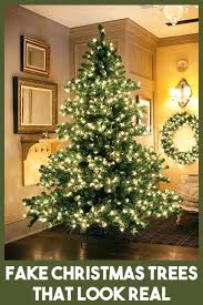Most Realistic Artificial Christmas Tree Reviews Deals For 2020 Holiday Season Realistic Artificial Christmas Trees Christmas Tree Clear Lights Christmas Tree Lighting