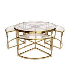Enjoy the smooth lines and gentle curves of our round retro coffee tables and achieve a modern and chic aesthetic with a modern round coffee table made from wood, steel, glass, or marble. Sundance Nesting Coffee Table 5 Piece Gold With Clear Glass Interiors Online