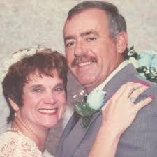 How to decorate a small living room with a blue accent wall and wooden  floors?