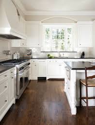 Dark flooring and cabinets with an authentic this kitchen with a dark wood island looks brilliant because the dark flooring blends in with the the dark wooden floor in this modern kitchen immediately creates a feeling of calmness and eccentricity. Dark Wood Floor Ideas Kitchen Savillefurniture