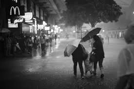 Storm level downgraded twice before amber warning cancelled at 12.30pm, though some areas a woman walks through central after hong kong's first black rainstorm warning of the year was issued. Hong Kong Observatory Issues Red Rainstorm Warning Possible Black To Come Coconuts Hong Kong