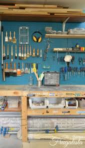 An Organized Basement Workshop With Paint Brush Pegboard Storage And Diy Workbench The Interio Basement Organization Basement Workshop Garage Tool Organization