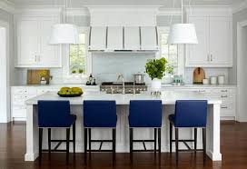 Royal Blue Counter Stools Provide A Comfortable Low Profile Perch At A White Kitchen Island Offering A Stools For Kitchen Island Kitchen Design Kitchen Stools