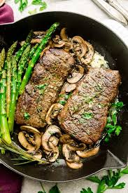 When the butter is melted and start to brown add the steak and reduce the head to medium. Garlic Steak With Herb Butter Asparagus Mushrooms Best Skillet Pan