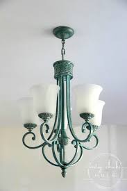From the fixture makeover to the new cree bulbs our master bathroom has taken another leap forward. How To Paint Light Fixtures Update Without Taking Them Down Artsy Chicks Rule