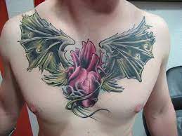 Chest Tattoo Ideas Ships Flaming Playing Cards Ships The Four Horsemen Skull Incorporated Angel Win Heart With Wings Tattoo Tattoos For Guys Chest Tattoo
