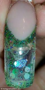 Women Are Wearing Press On Nails Filled With Moving Liquid And Glitter Aquarium Nails Crazy Nail Art Fashion Nails