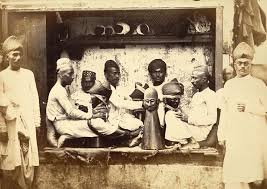 RBSI - Bhattia turban folders at work - 1873 Photograph of turban folders at work in India, taken by Shivashanker Narayen in c. 1873, from the Archaeological Survey of India Collections. This image, of a