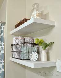 They accommodate tissue paper rolls, wicker baskets, flowers in vase, and towels. 42 Bathroom Shelf Ideas To Keep Your Space Uncluttered