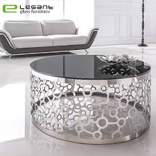 The design is contemporary, and the an attractive vintage coffee table entirely crafted of wrought iron with an aged black finish and traces of rust. China Artistic Metal Base Black Glass Coffee Table China Coffee Table Glass Coffee Table