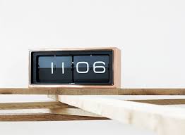 The unique feature of this clock is how it is supported by its own shadow. Table Clocks Better Living Through Design